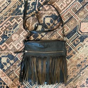 Black Leather Fringe Purse with silver hardware. Good, used condition.